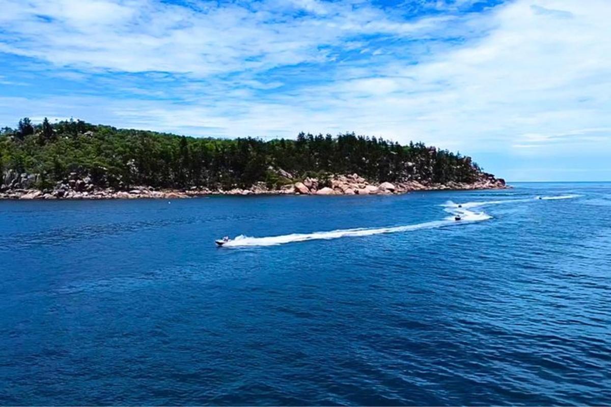 a boat in the water near an island