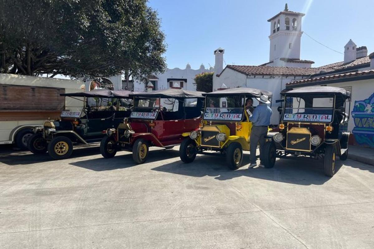 a group of golf carts parked in a parking lot