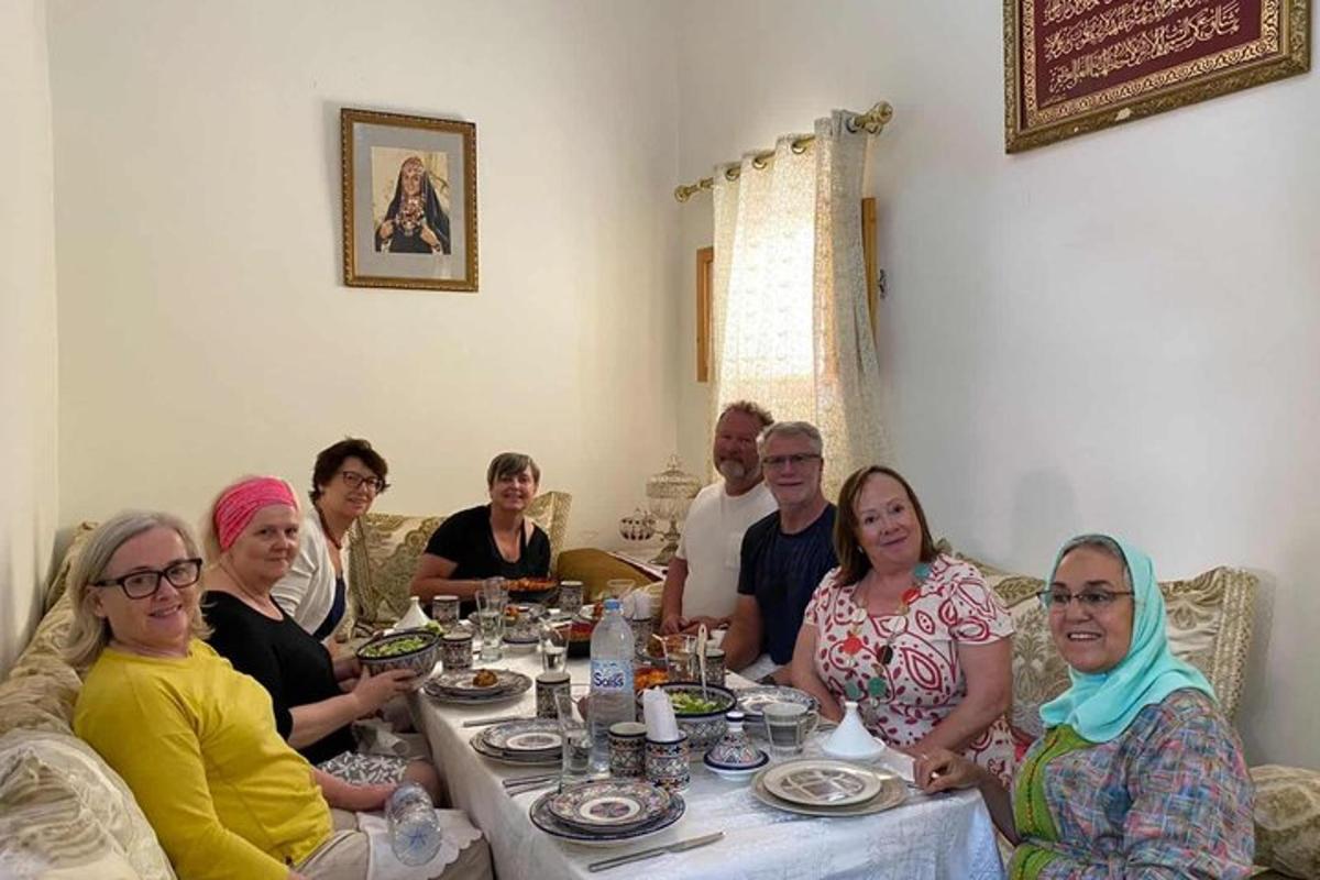 a group of people sitting around a table eating