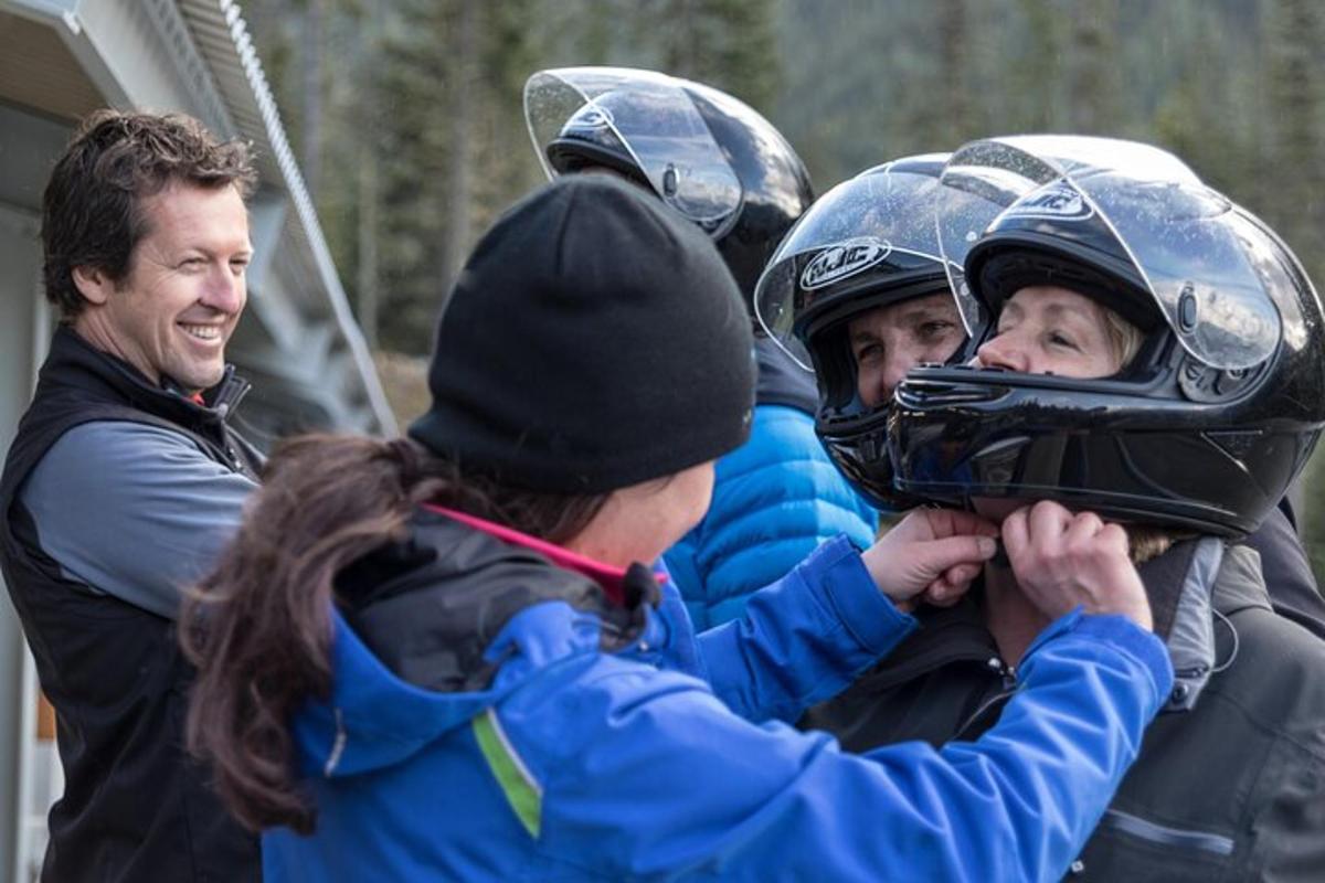 a group of children wearing helmets and a man