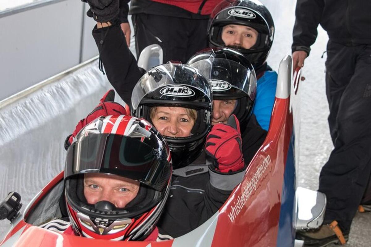 a group of people in ski gear on a ramp
