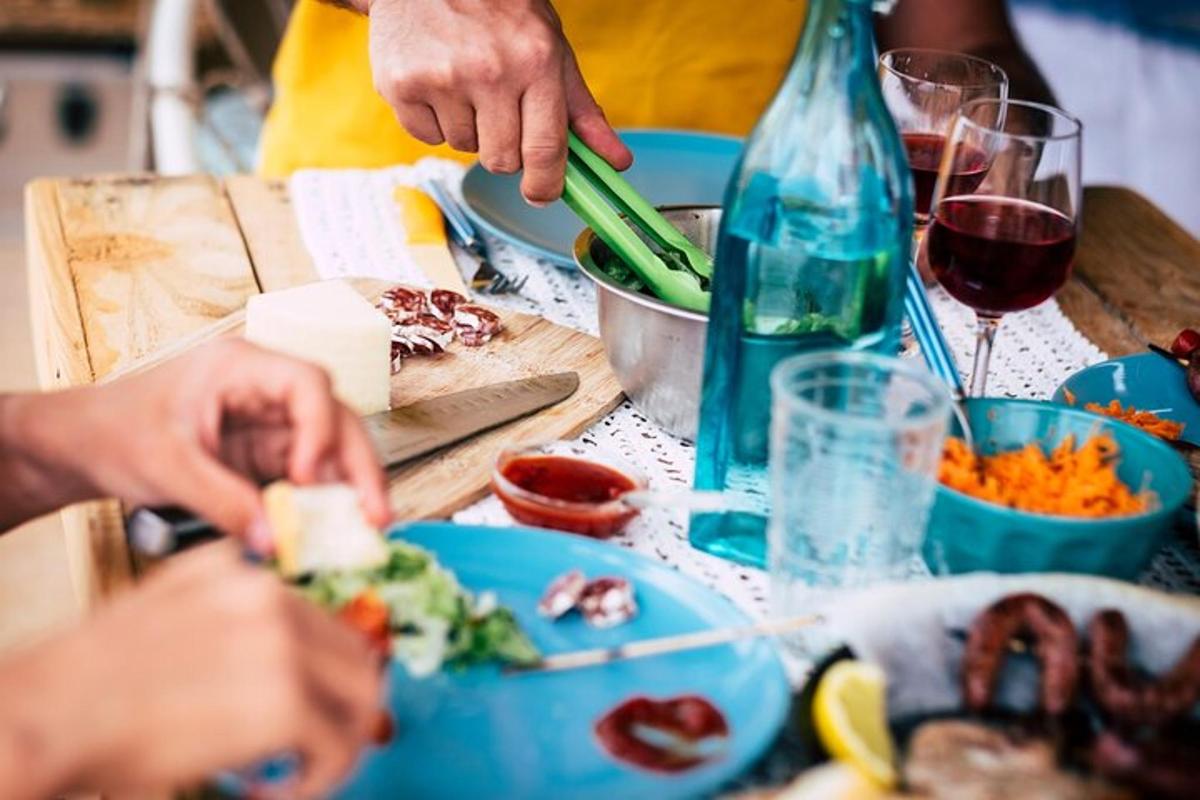 a group of people sitting at a table eating food