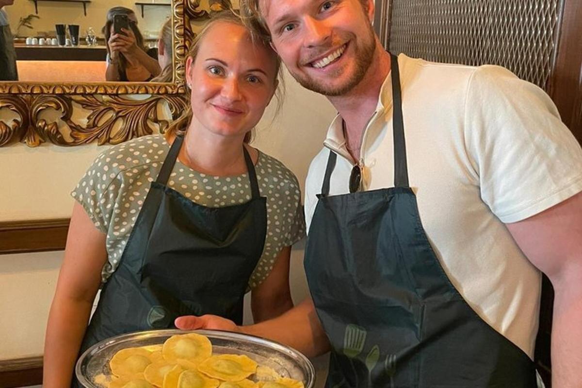 a man and a woman holding a bowl of food