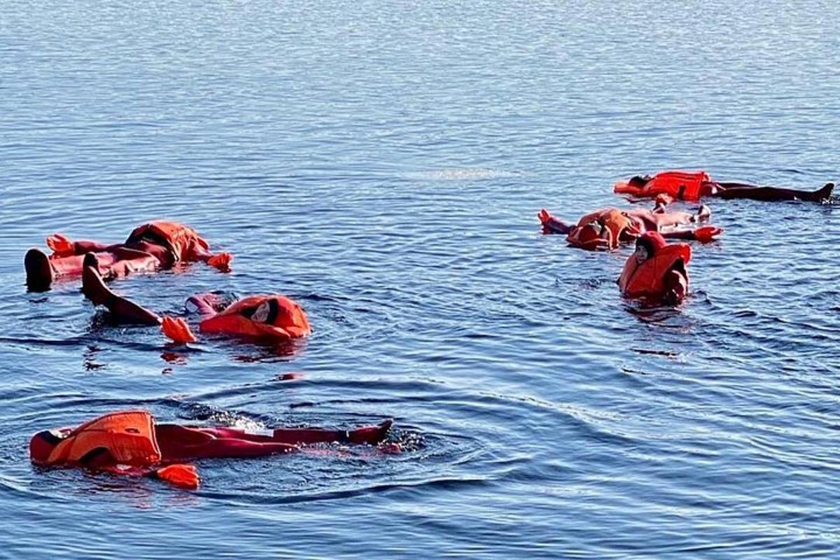 a group of people floating in the water
