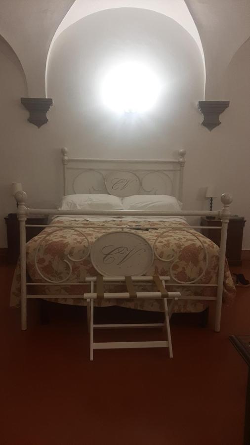 Letto o letti in una camera di Castello Vicchiomaggio