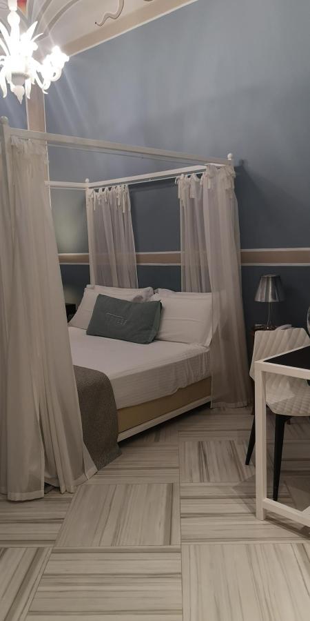 Letto o letti in una camera di Coclee Suite Palace