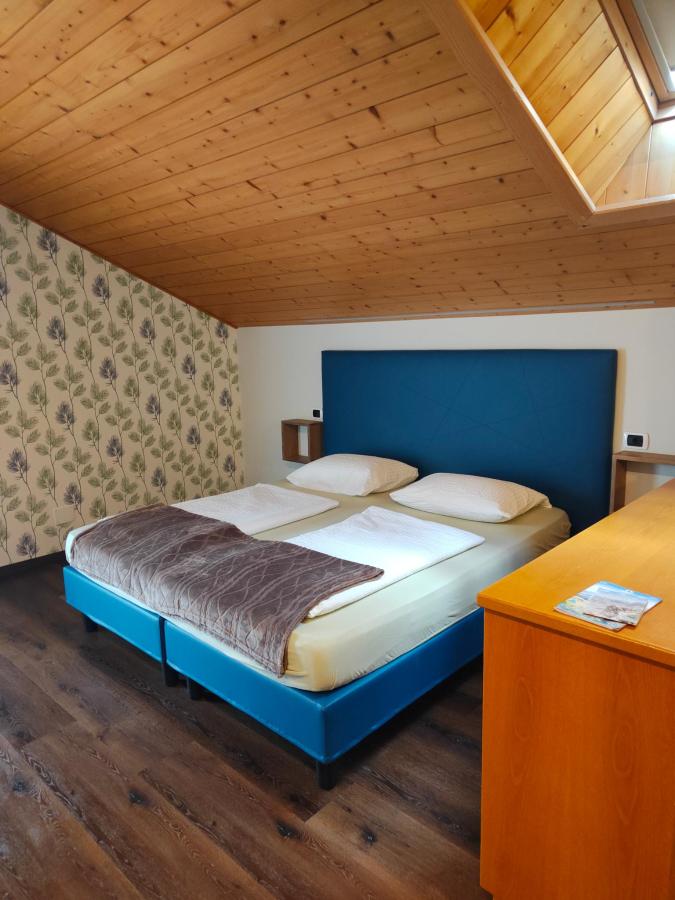 Letto o letti in una camera di FORESTO holiday apartments - Piscina, SpA e Relax
