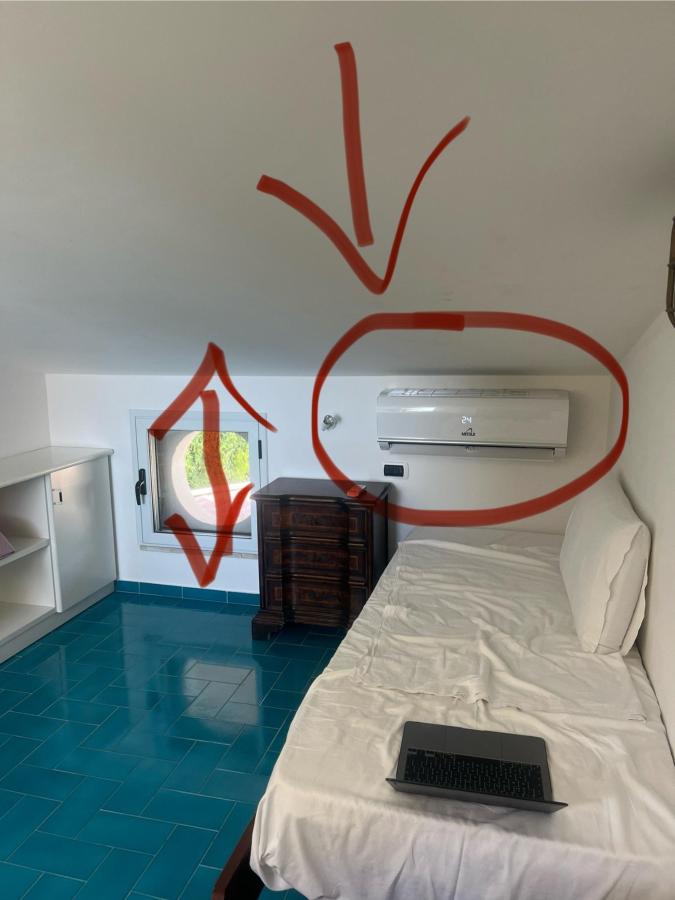 Letto o letti in una camera di Villa Kore, Capo Vaticano