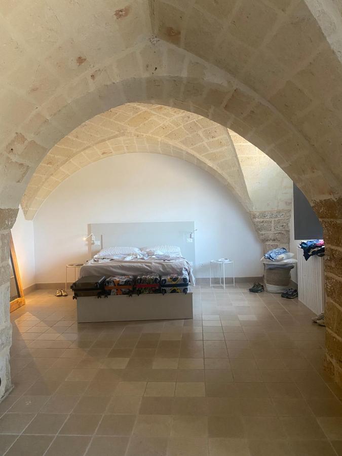 Letto o letti in una camera di Masseria Malvindi