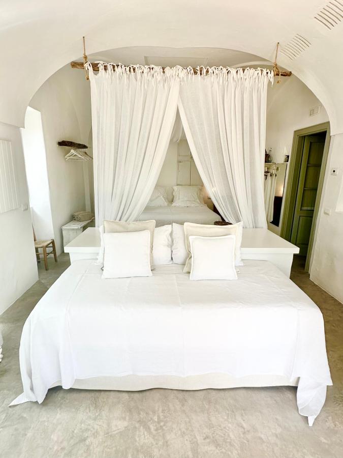 Letto o letti in una camera di Masseria Le Torri