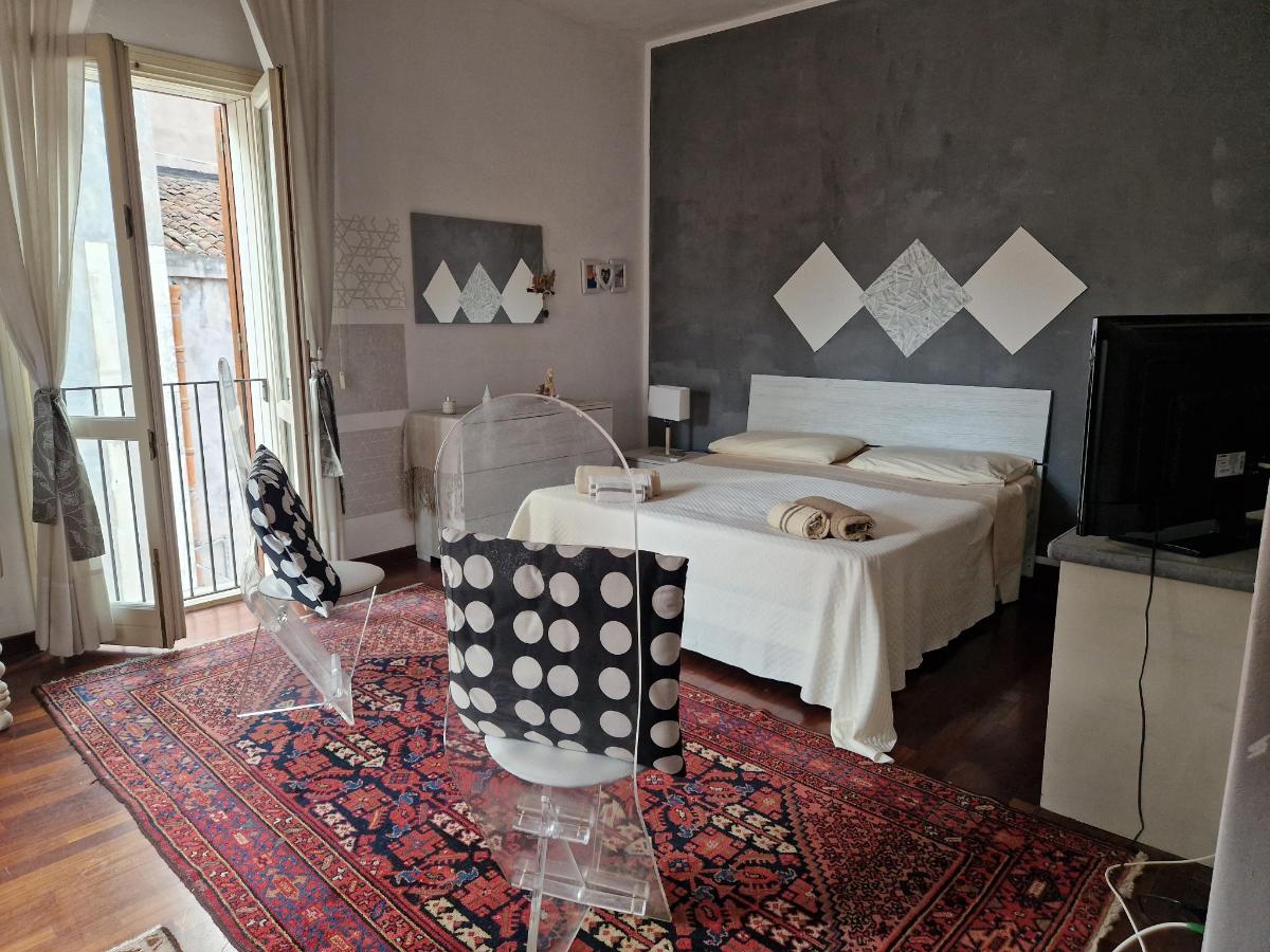 Letto o letti in una camera di Don Camillo Suites