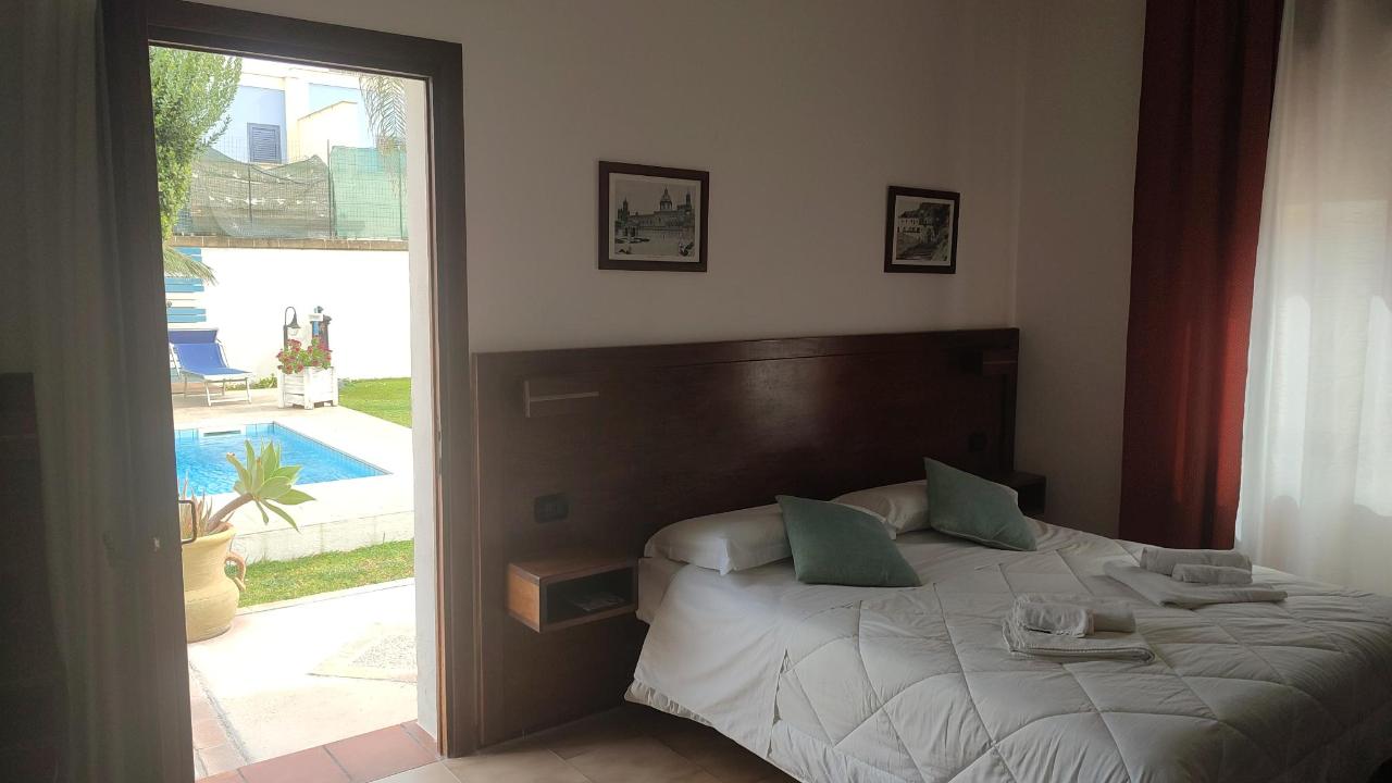 Letto o letti in una camera di Brunelli Residence