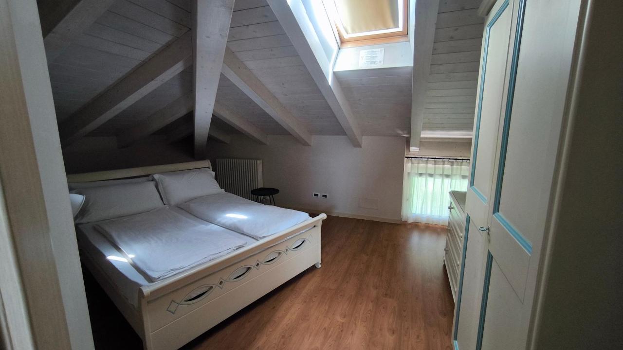 Letto o letti in una camera di Arcovacanze