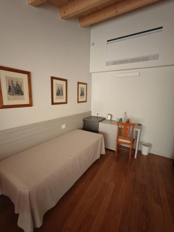 Letto o letti in una camera di Residenza Ai Capitelli