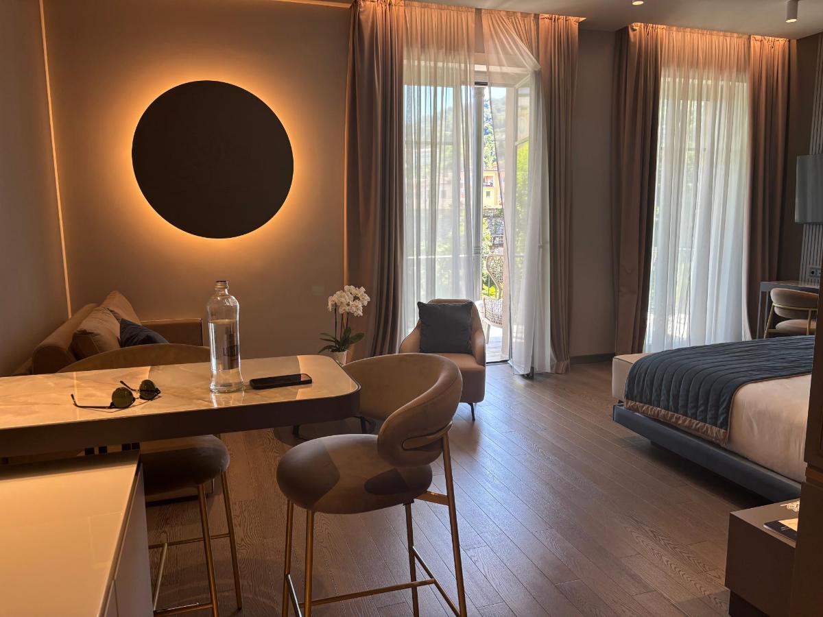 Letto o letti in una camera di Boutique Hotel Stresa