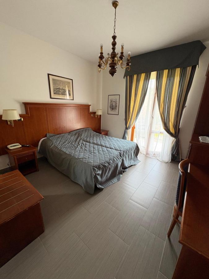 Letto o letti in una camera di Hotel Posta