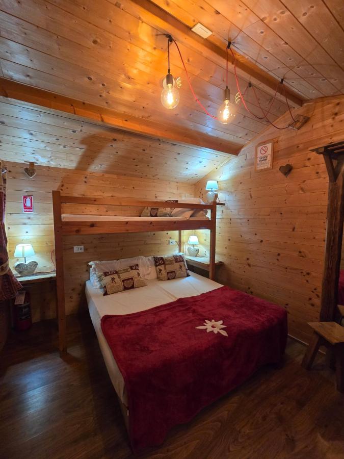 Letto o letti in una camera di Stura River Village RAFTING