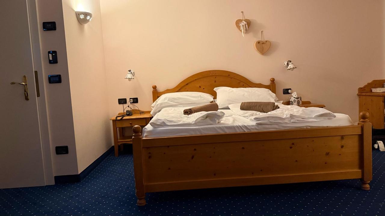 Letto o letti in una camera di Hotel Garnì Carpe Diem