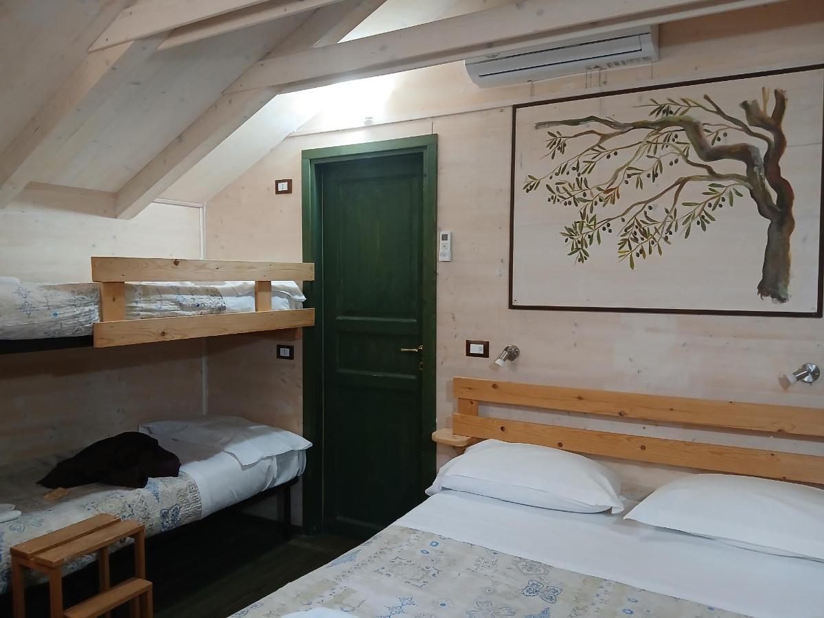 Letto o letti in una camera di Palazzo Conforti Tree House Resort