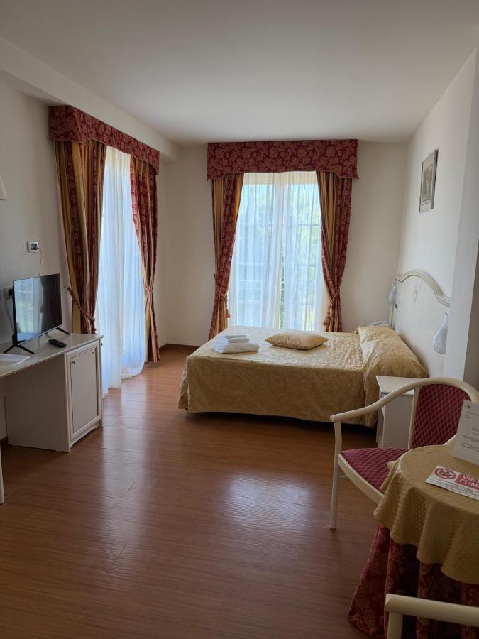 Letto o letti in una camera di Hotel Vedute