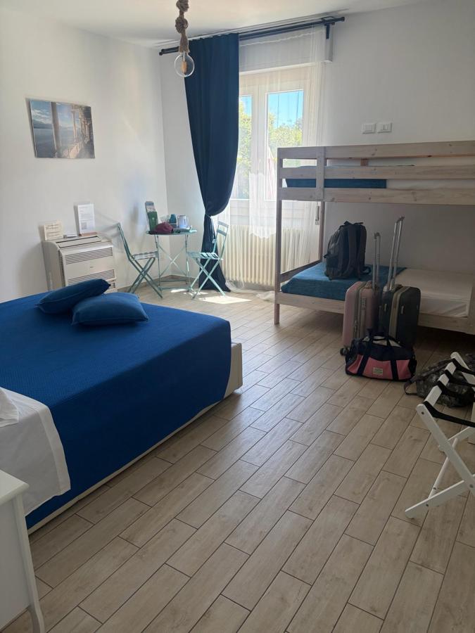 Letto o letti in una camera di B&B La Rosa del Lago