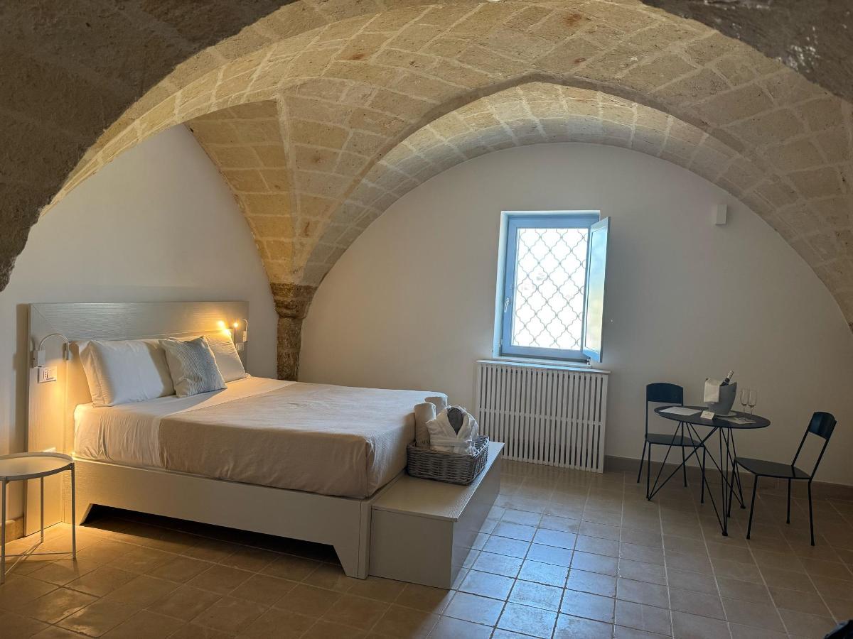 Letto o letti in una camera di Masseria Malvindi